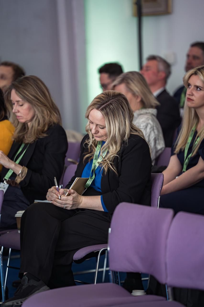 Lucy Pitcher working alongside a group at a conference